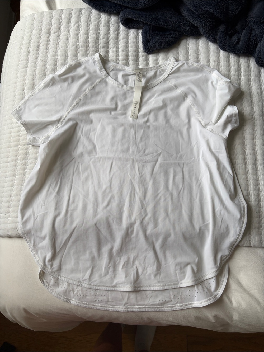 lululemon athletica white short sleeve performance top with side slit NWOT